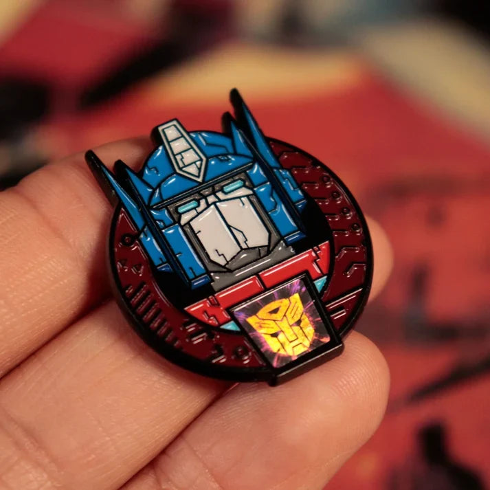 Transformers – Official 40th Anniversary Twin Set of Pin Badges Pin Set - Tophatter Daily Deals
