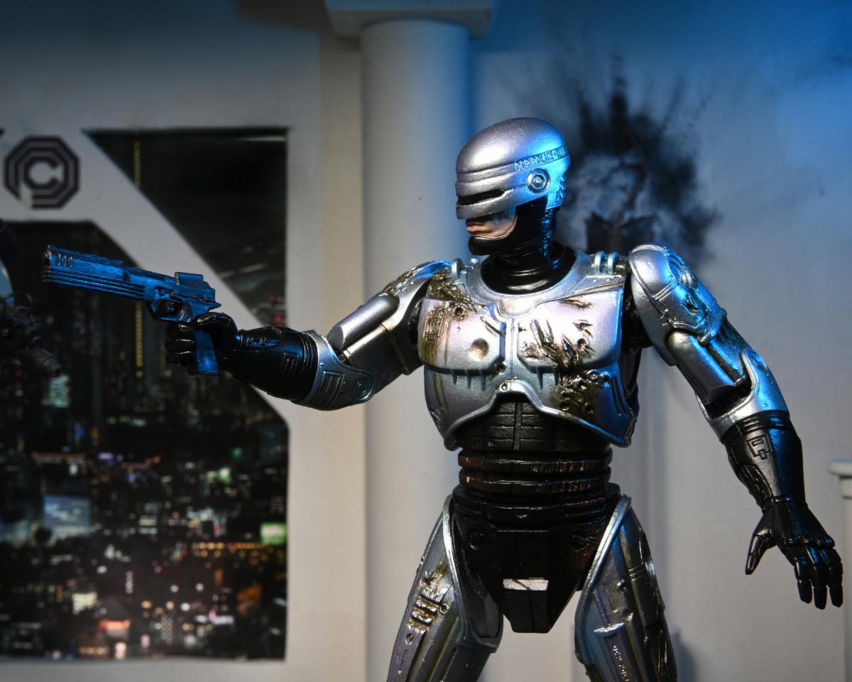 RoboCop – Official Ultimate Battle-Damaged RoboCop with Chair Figure Action Figure - Tophatter Daily Deals