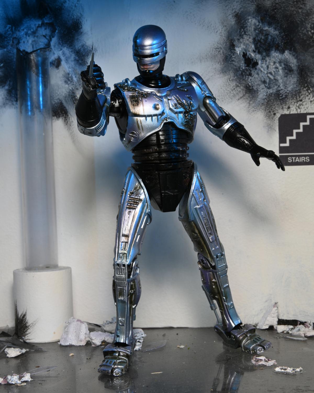 RoboCop – Official Ultimate Battle-Damaged RoboCop with Chair Figure Action Figure - Tophatter Daily Deals
