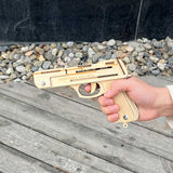 Assembled Wooden Rubber Band Gun Pistol Model Kit With Wooden bullets - Tophatter Daily Deals