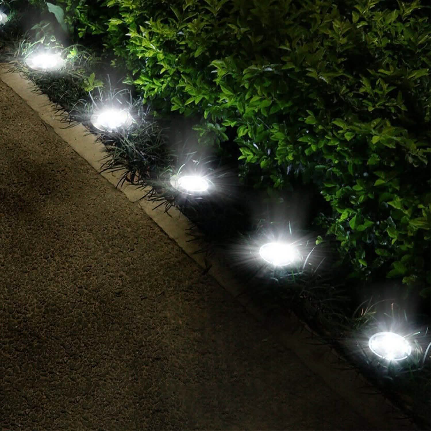4-Pieces: Solar Powered Ground Light Outdoor Lighting - Tophatter Daily Deals