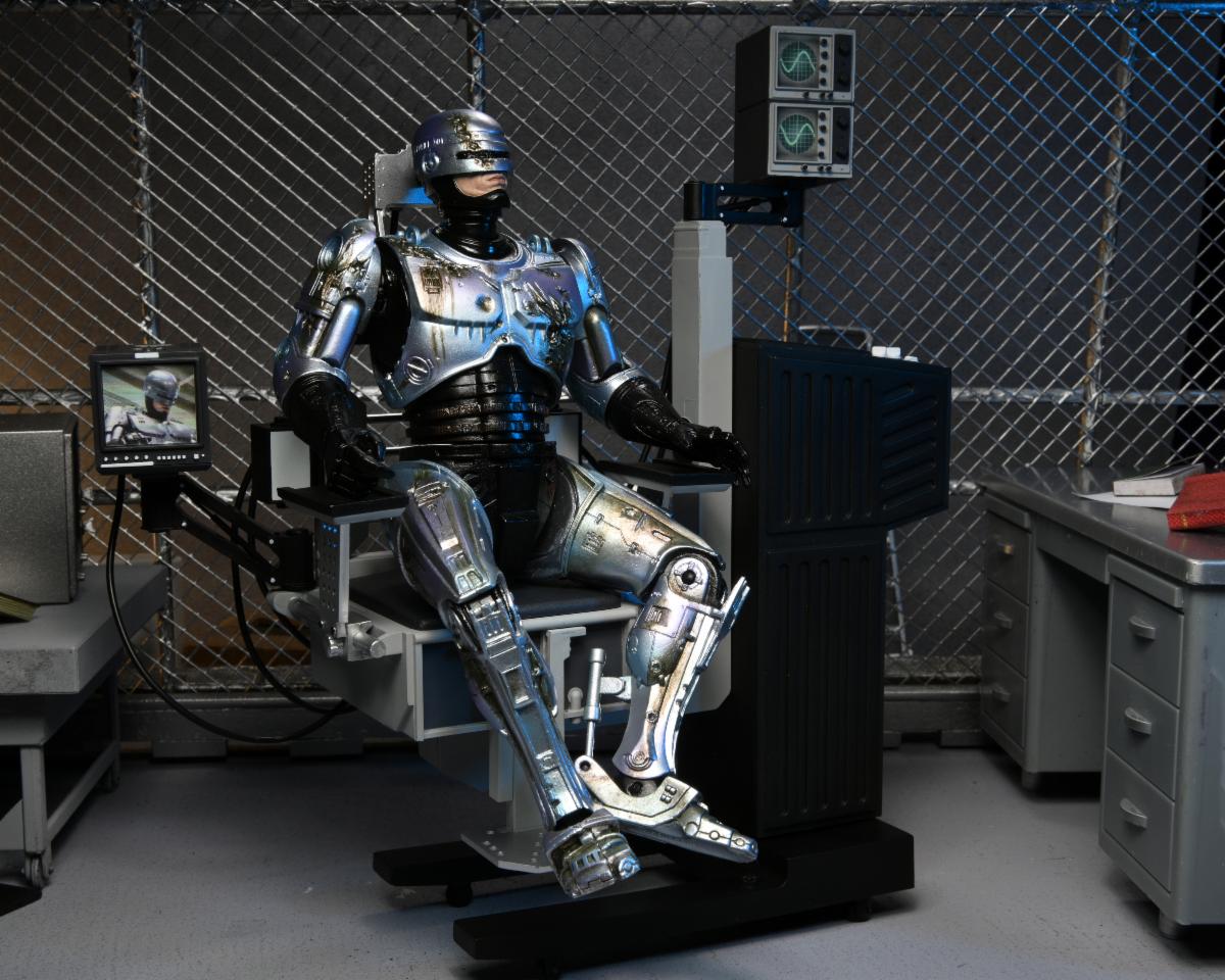 RoboCop – Official Ultimate Battle-Damaged RoboCop with Chair Figure Action Figure - Tophatter Daily Deals