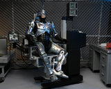 RoboCop – Official Ultimate Battle-Damaged RoboCop with Chair Figure Action Figure - Tophatter Daily Deals