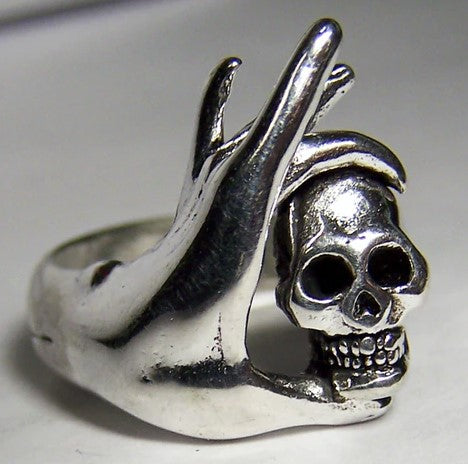 HAND WITH FINGERS HOLDING SKULL HEAD BIKER RING - Tophatter Daily Deals