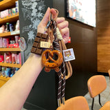 Woven Rope Bowknot Keychain With Cute Pastry Charms - Tophatter Daily Deals