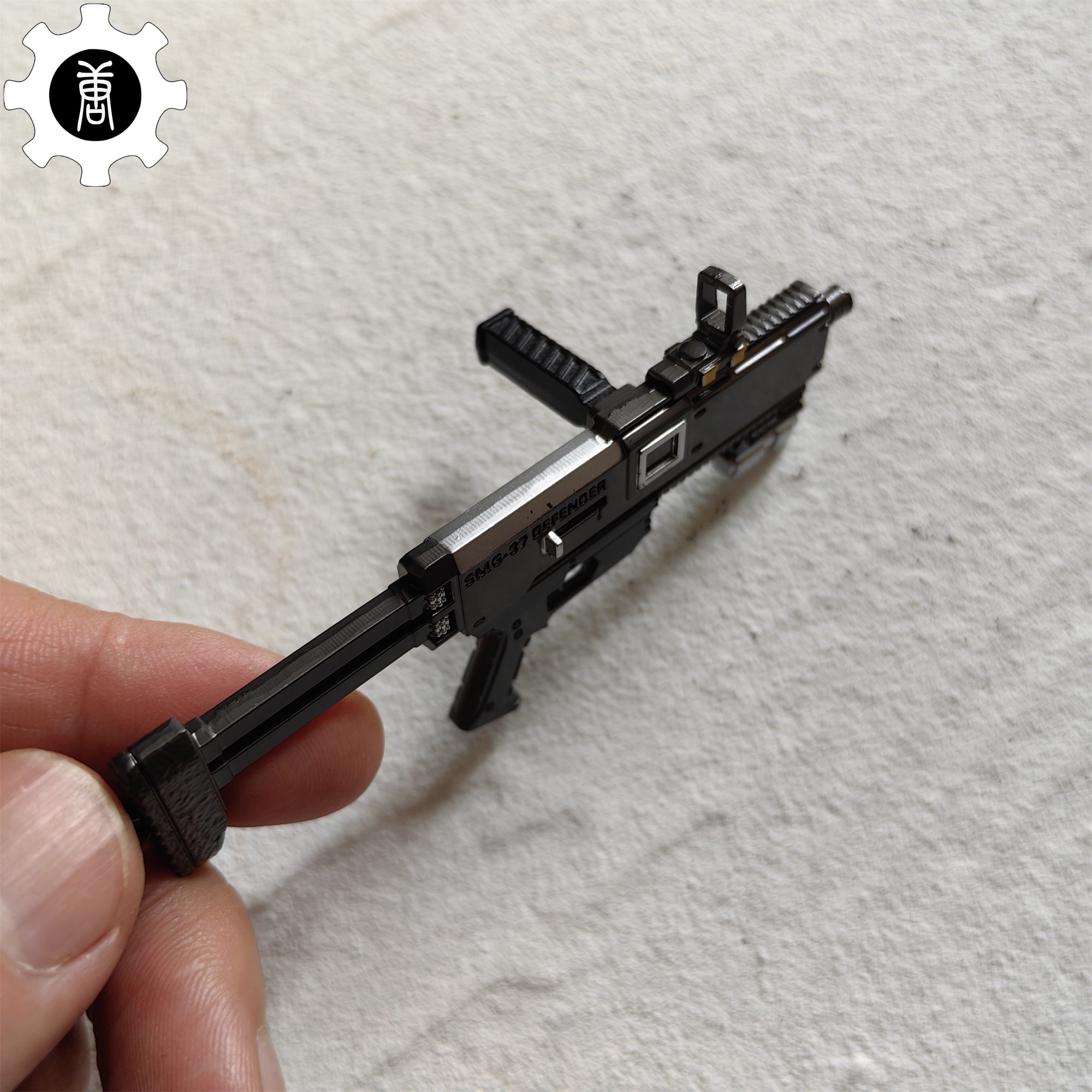 Tiny SMG-37 Defender Submachine Gun Model Metal Keychain - Tophatter Daily Deals