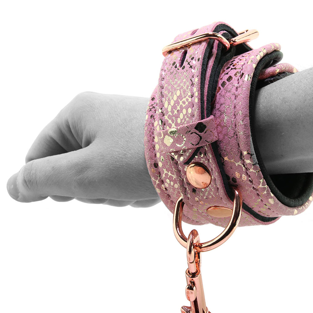 Locking Leather Wrist Restraint Cuffs in Pink Snake Print - Tophatter's Adult Products Bondage and Fetish > Wrist and Ankle Cuffs - Tophatter Daily Deals