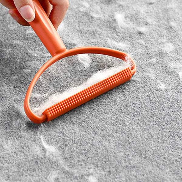 Ergonomic Pet Hair & Lint Remover Orange Colow Showing Removing Pet Hair