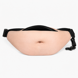 A novelty fanny pack designed to look like a human belly, featuring a realistic beige skin texture with a printed navel and a black adjustable strap with plastic buckles.